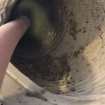 Rotobrush cleaning a return vent, pulling heavy dirt buildup in Gilbert, AZ